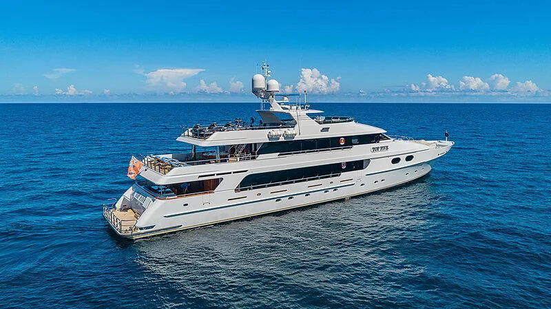 a large white boat in the water aboard AMORE Yacht for Charter