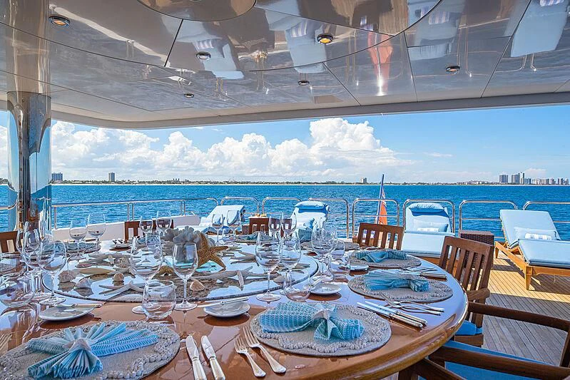 a table set for a dinner aboard AMORE Yacht for Charter