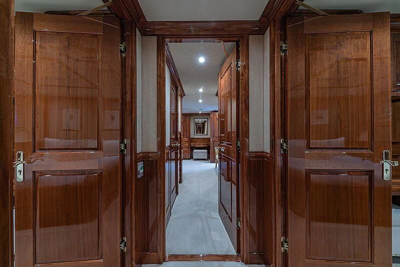 a room with wooden cabinets aboard AMORE Yacht for Charter