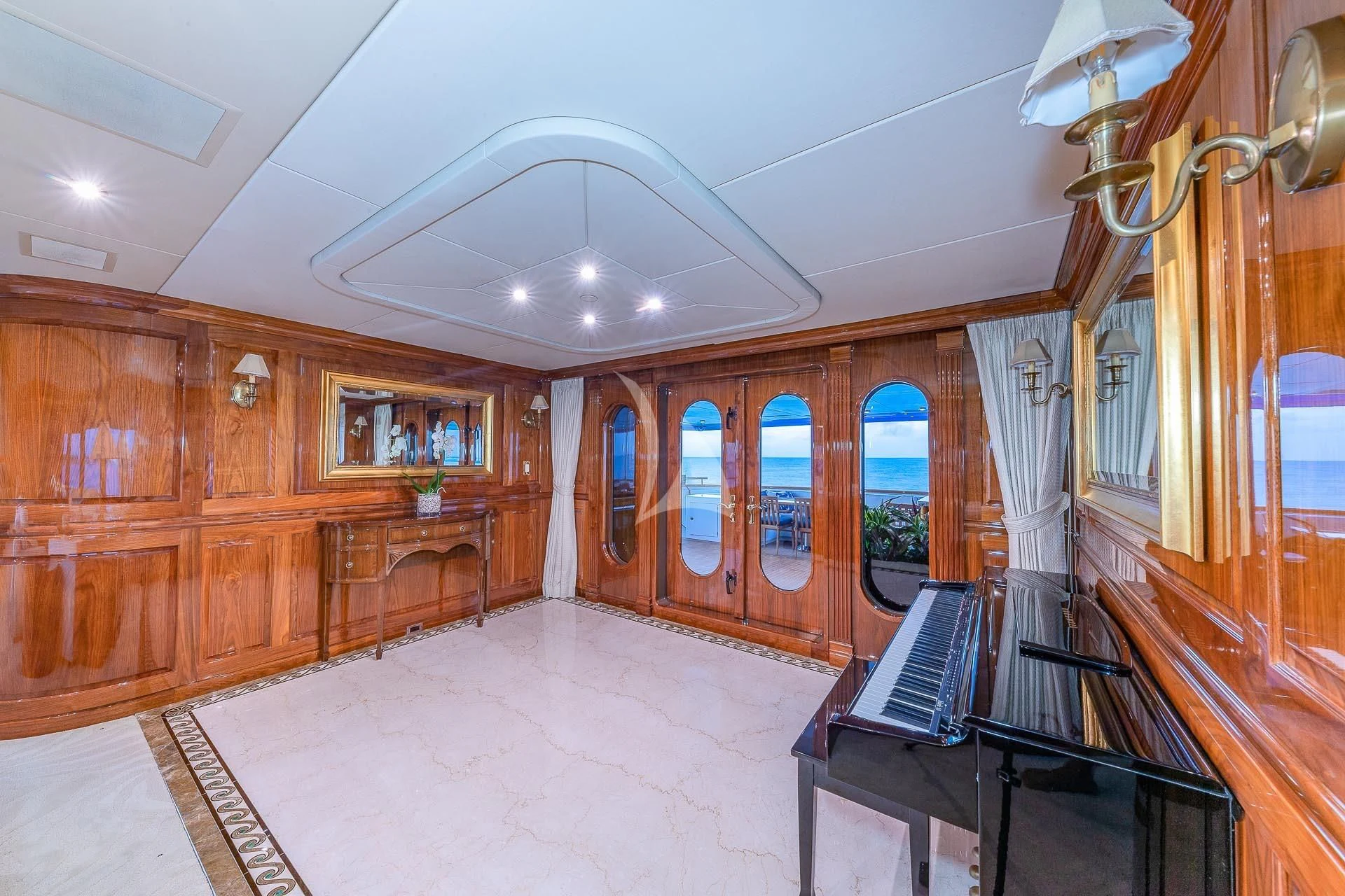 a large kitchen with wooden cabinets aboard AMORE Yacht for Charter