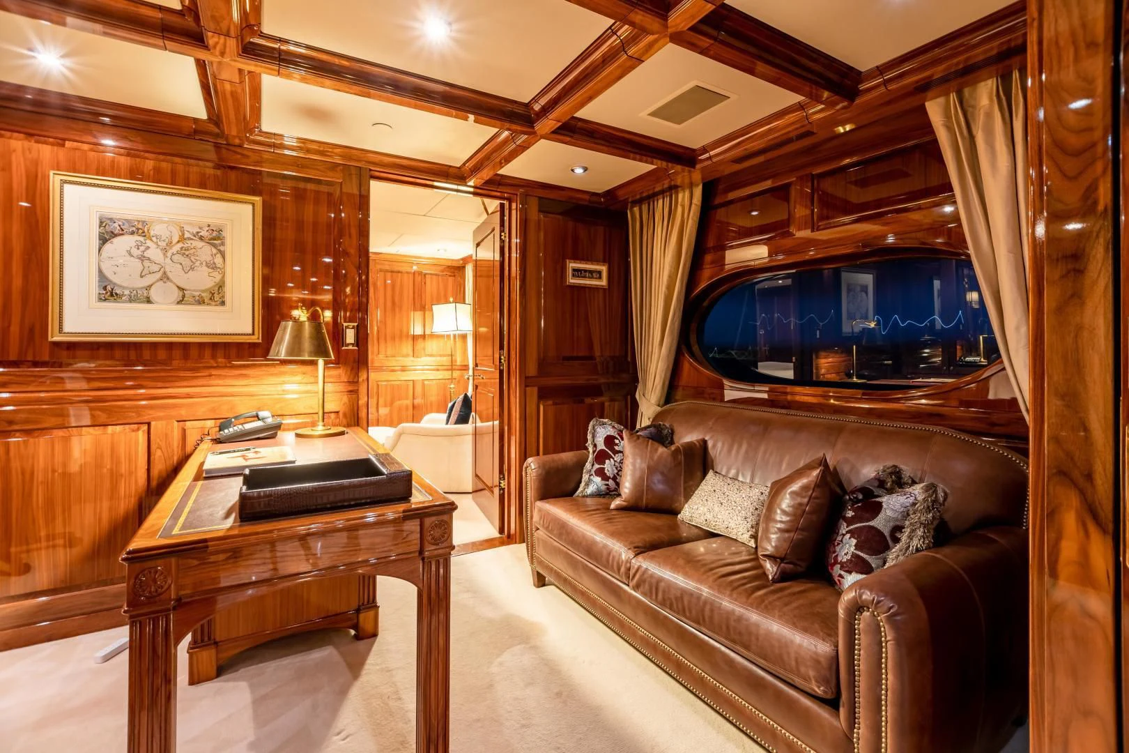 a living room with a leather couch aboard AMORE Yacht for Charter