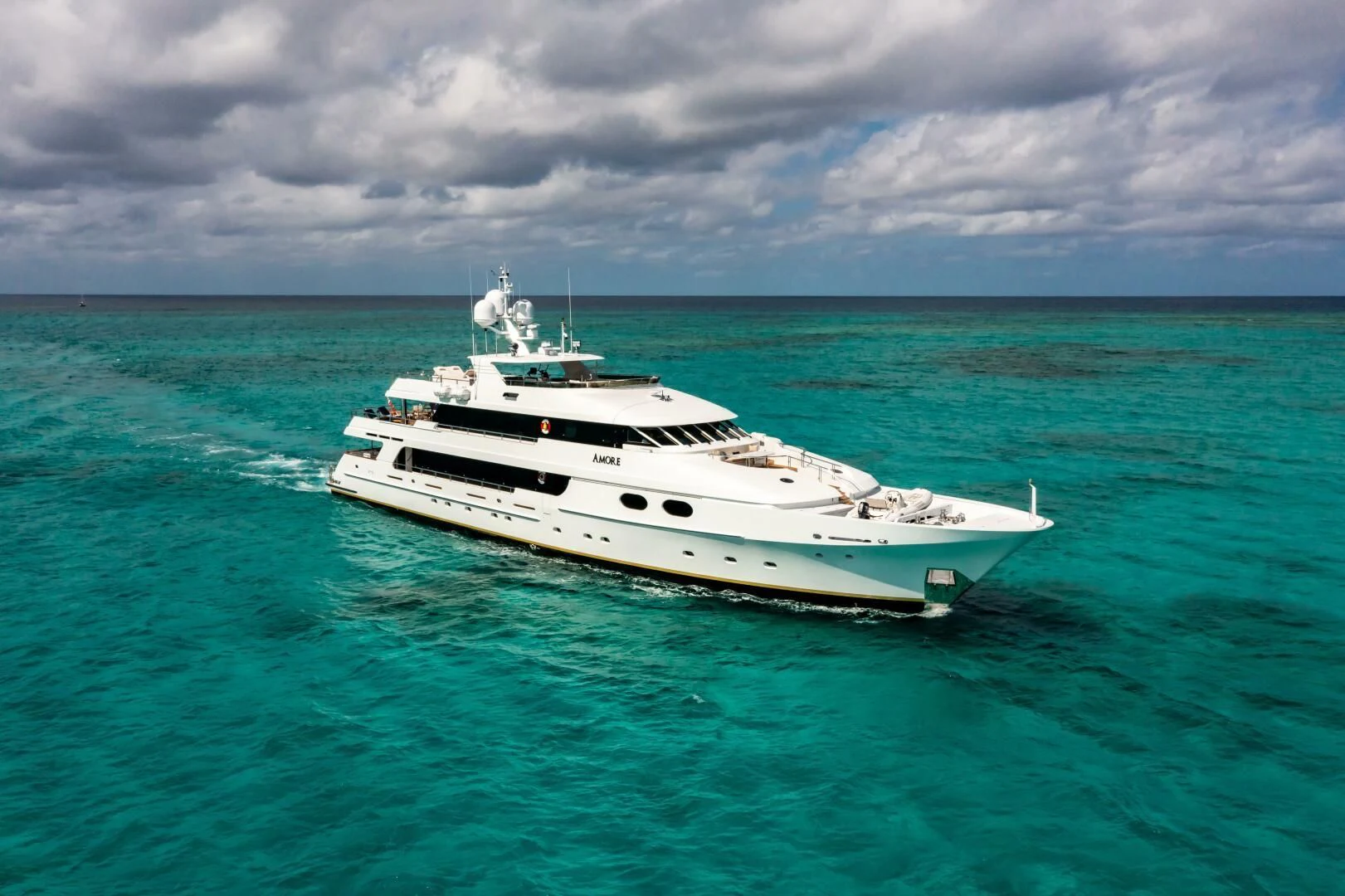 a white boat in the water aboard AMORE Yacht for Charter