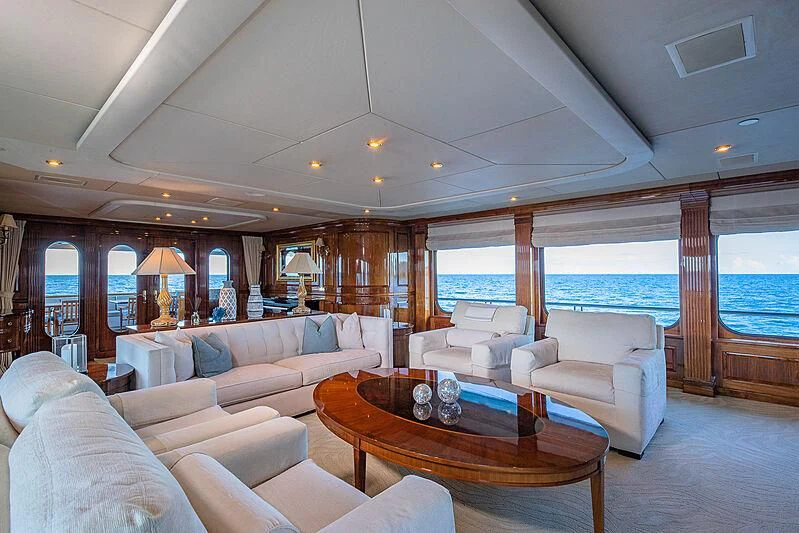 a living room with a large glass window aboard AMORE Yacht for Charter