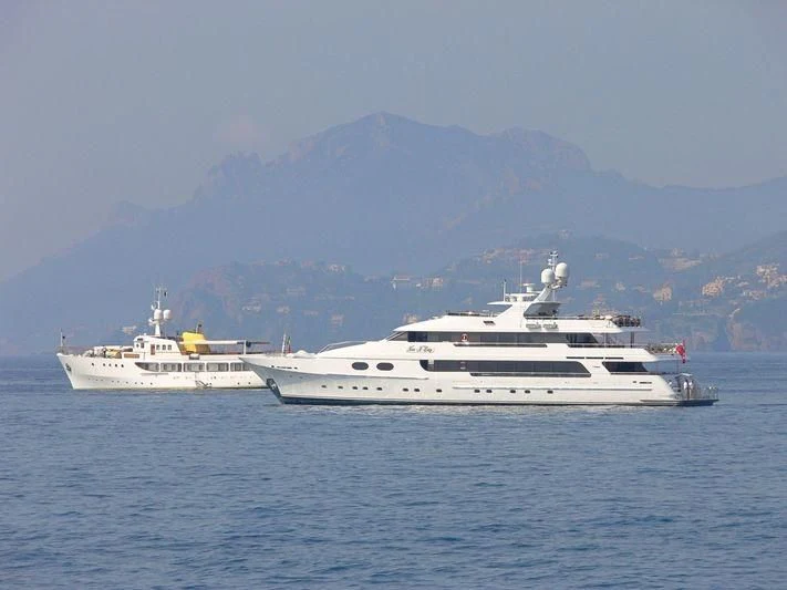 a couple of white boats in the water aboard AMORE Yacht for Charter