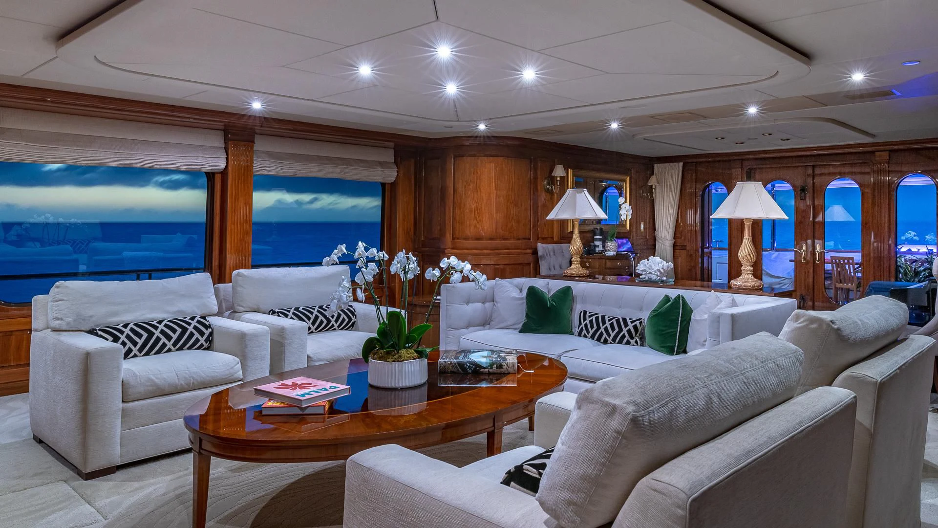 a living room with a large window aboard AMORE Yacht for Charter
