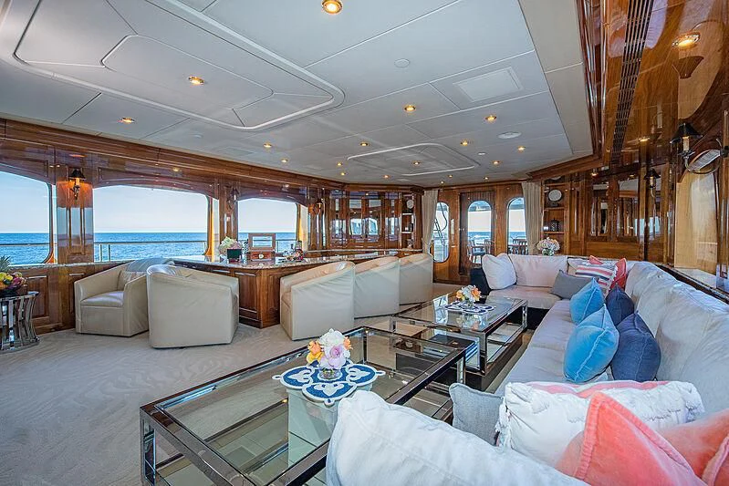 a living room with a large window aboard AMORE Yacht for Charter