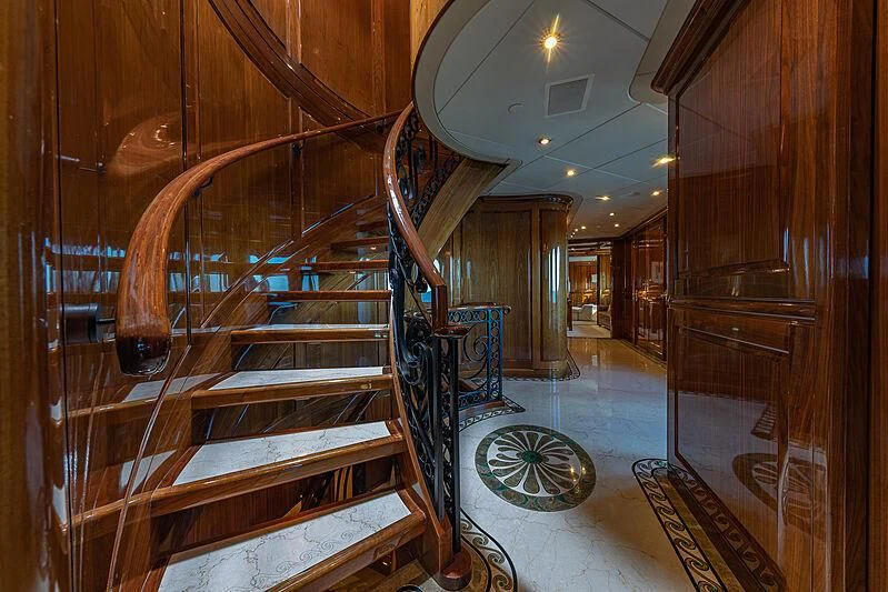 a large wooden staircase aboard AMORE Yacht for Charter