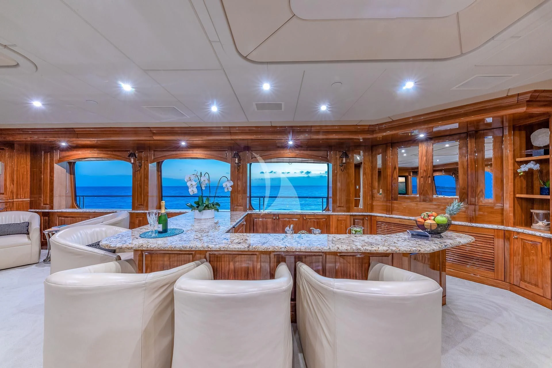 a room with a table and chairs aboard AMORE Yacht for Charter