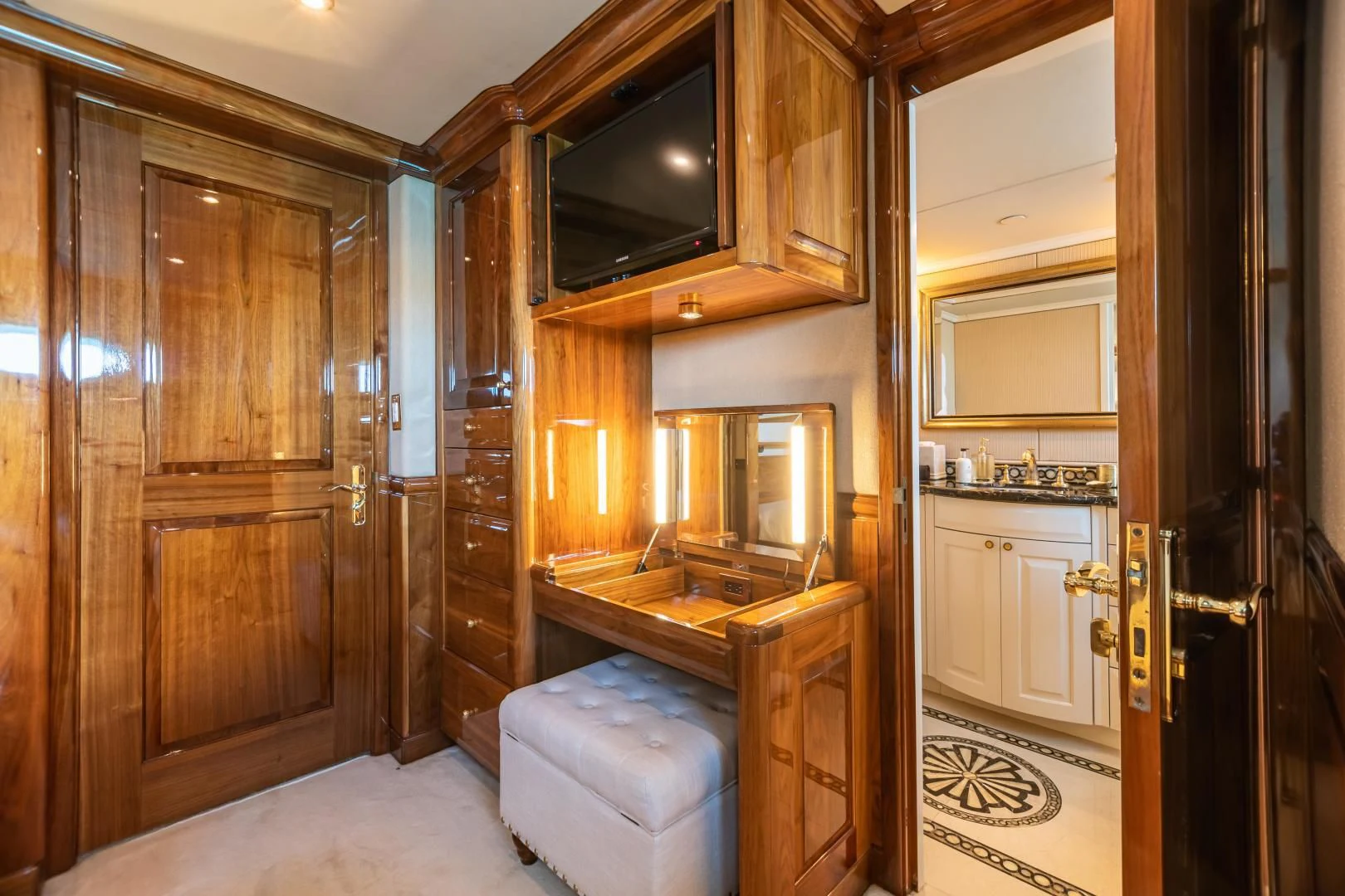 a bathroom with wooden cabinets aboard AMORE Yacht for Charter