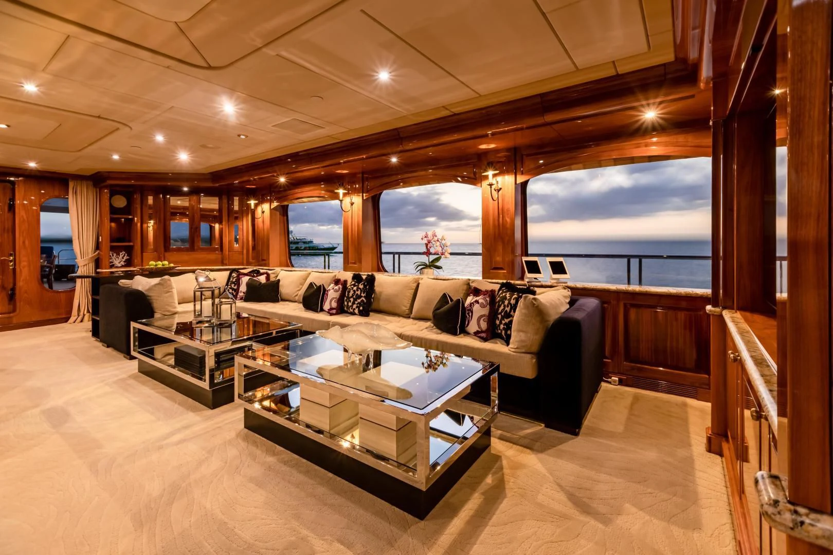 a living room with a large window aboard AMORE Yacht for Charter