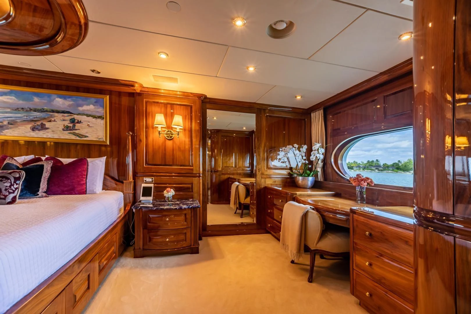 a bedroom with a large mirror aboard AMORE Yacht for Charter