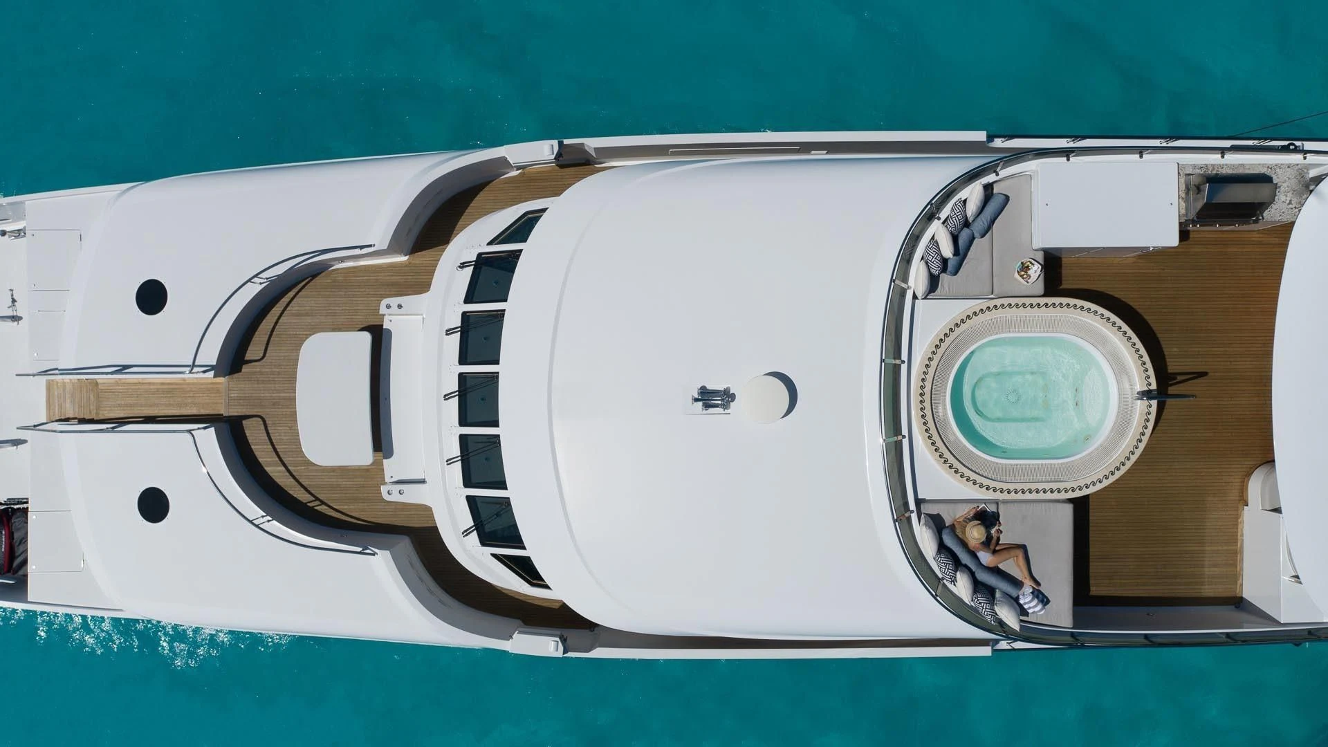 a white speaker on a green surface aboard AMORE Yacht for Charter