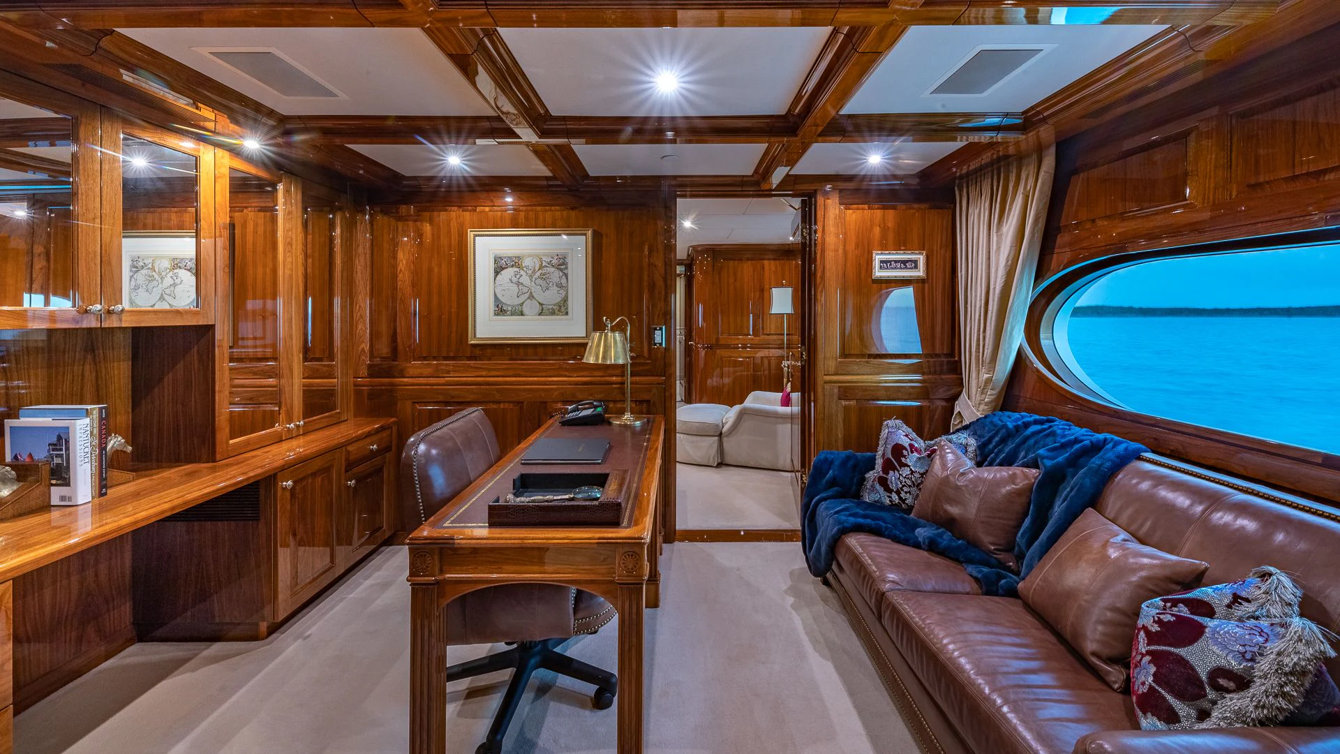 a living room with a couch and a table aboard AMORE Yacht for Charter