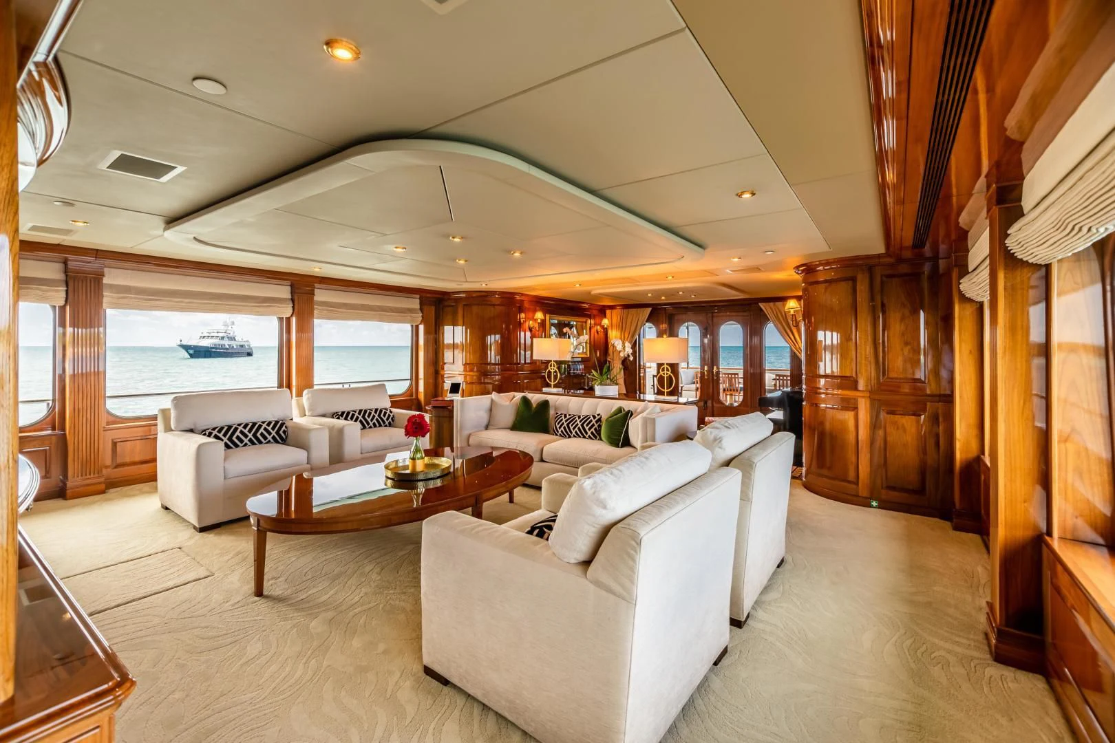 a living room with a large window aboard AMORE Yacht for Charter