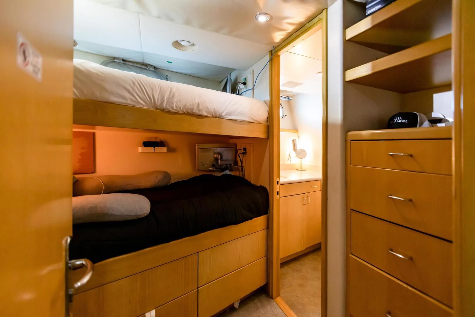 a room with a bed and a closet aboard AMORE Yacht for Charter