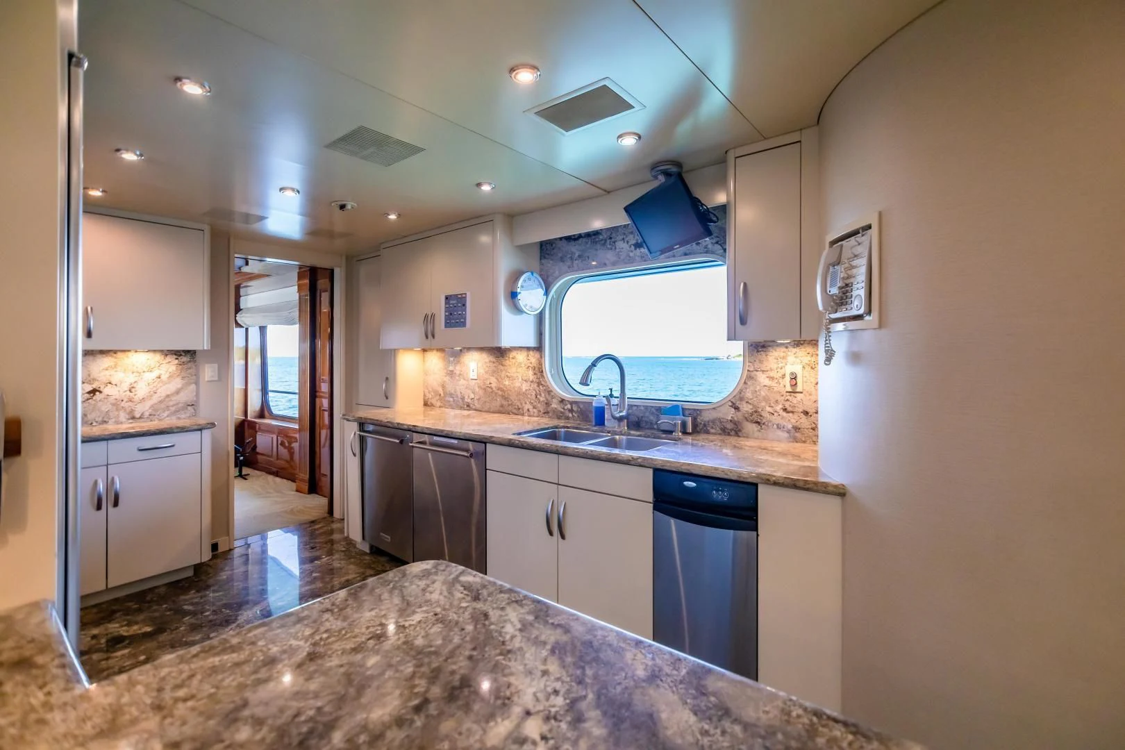 a kitchen with a marble counter top aboard AMORE Yacht for Charter