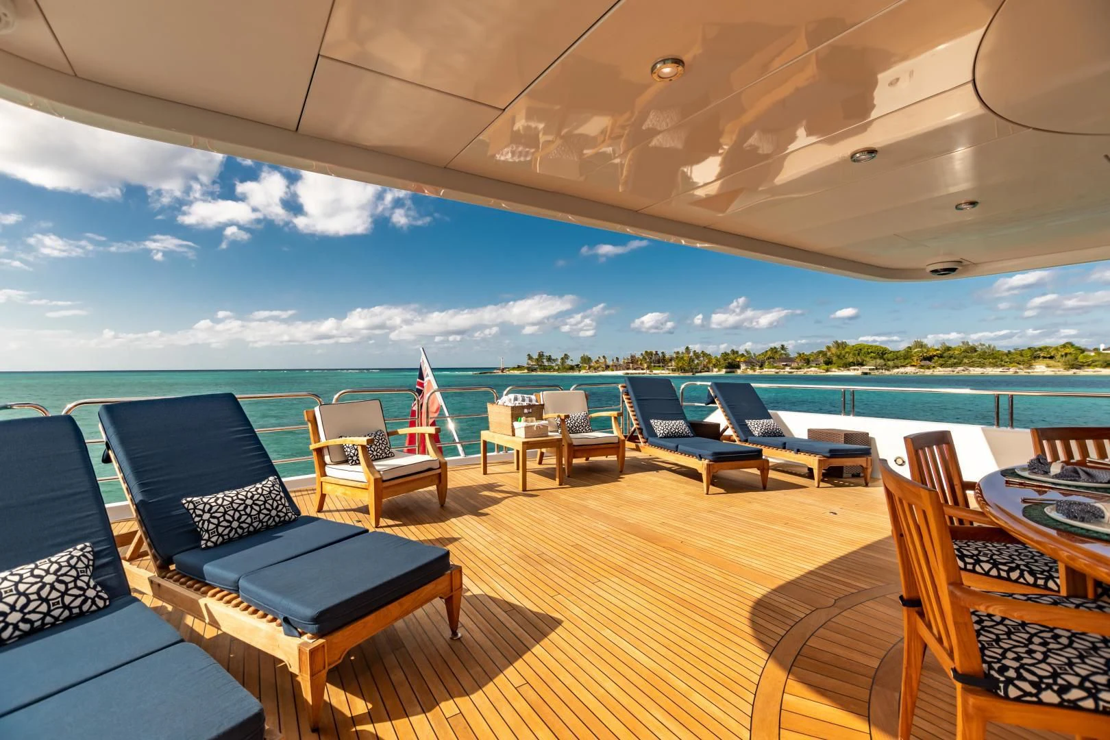a deck with chairs and a pool aboard AMORE Yacht for Charter