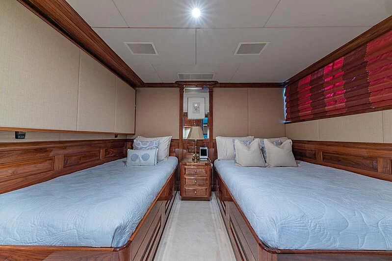 a room with two beds aboard AMORE Yacht for Charter