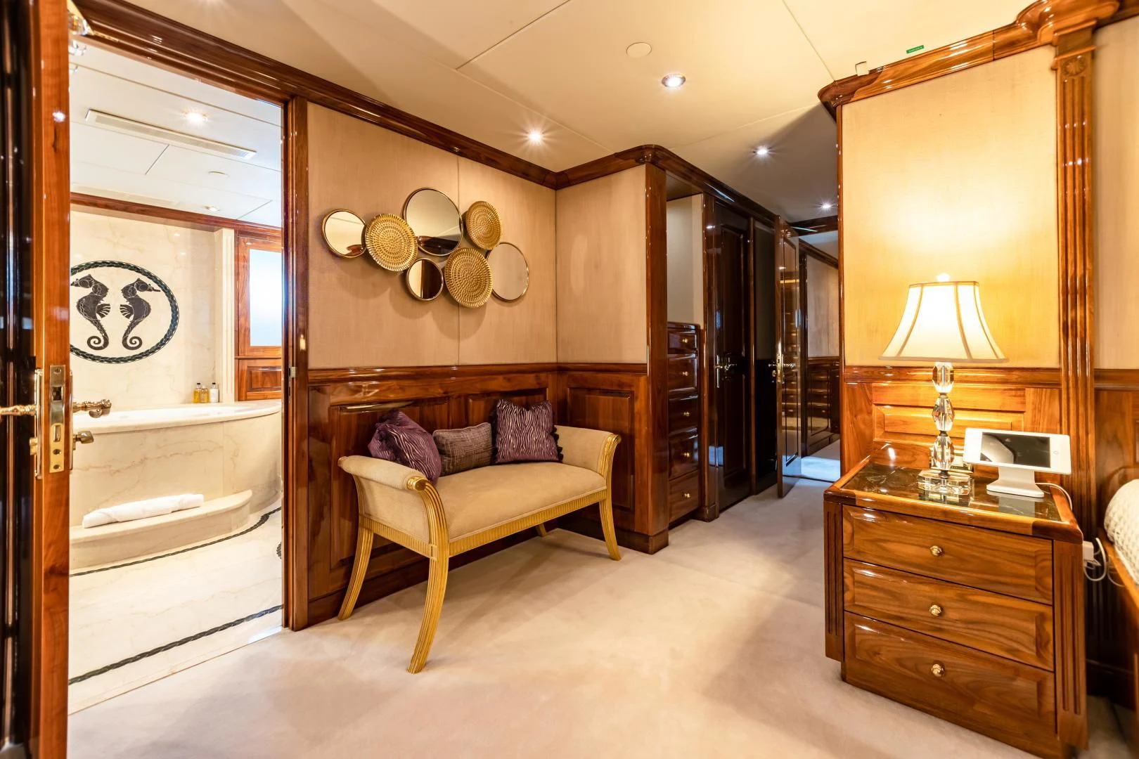 a room with a bed and a desk aboard AMORE Yacht for Charter