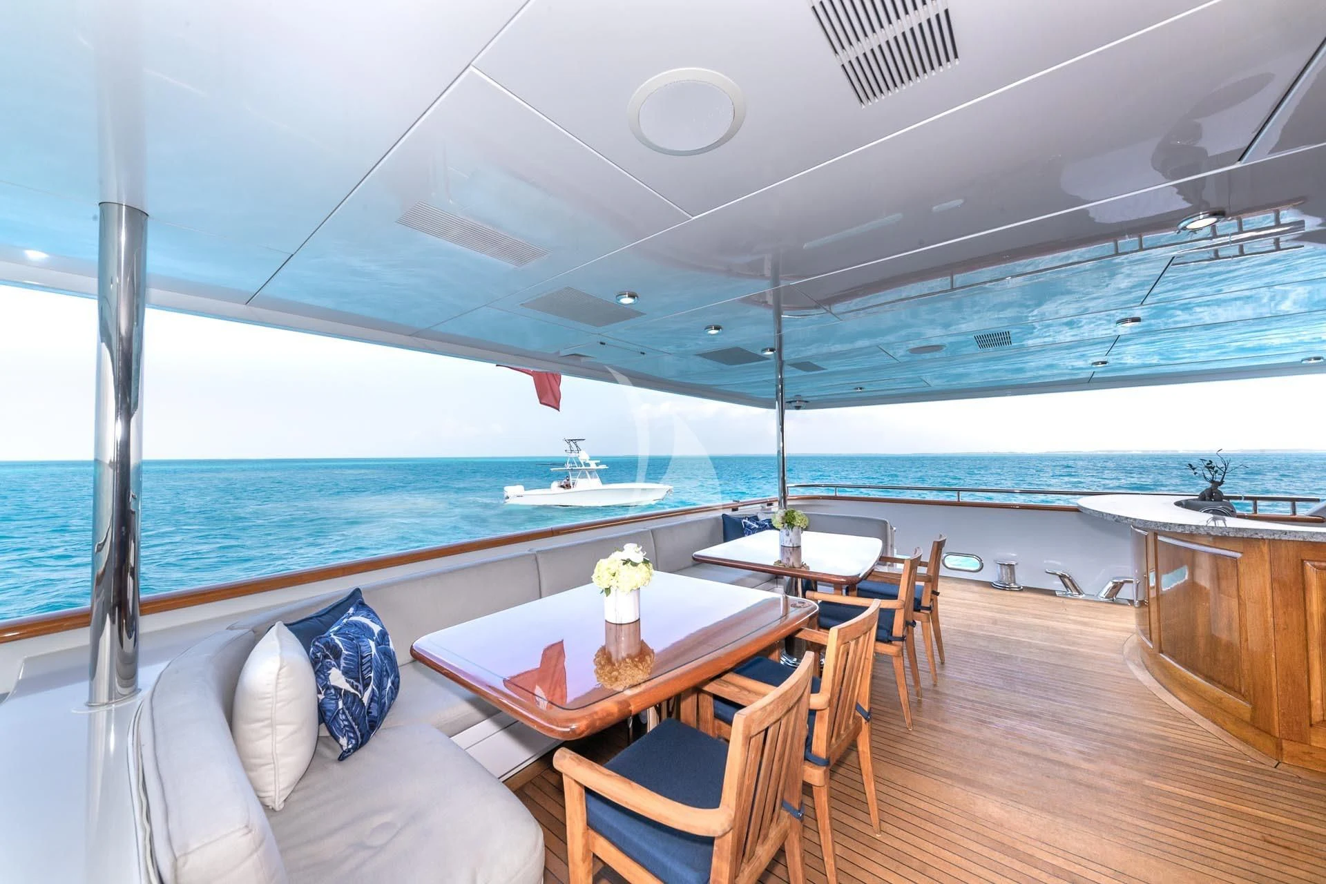 a room with a table and chairs aboard AMORE Yacht for Charter