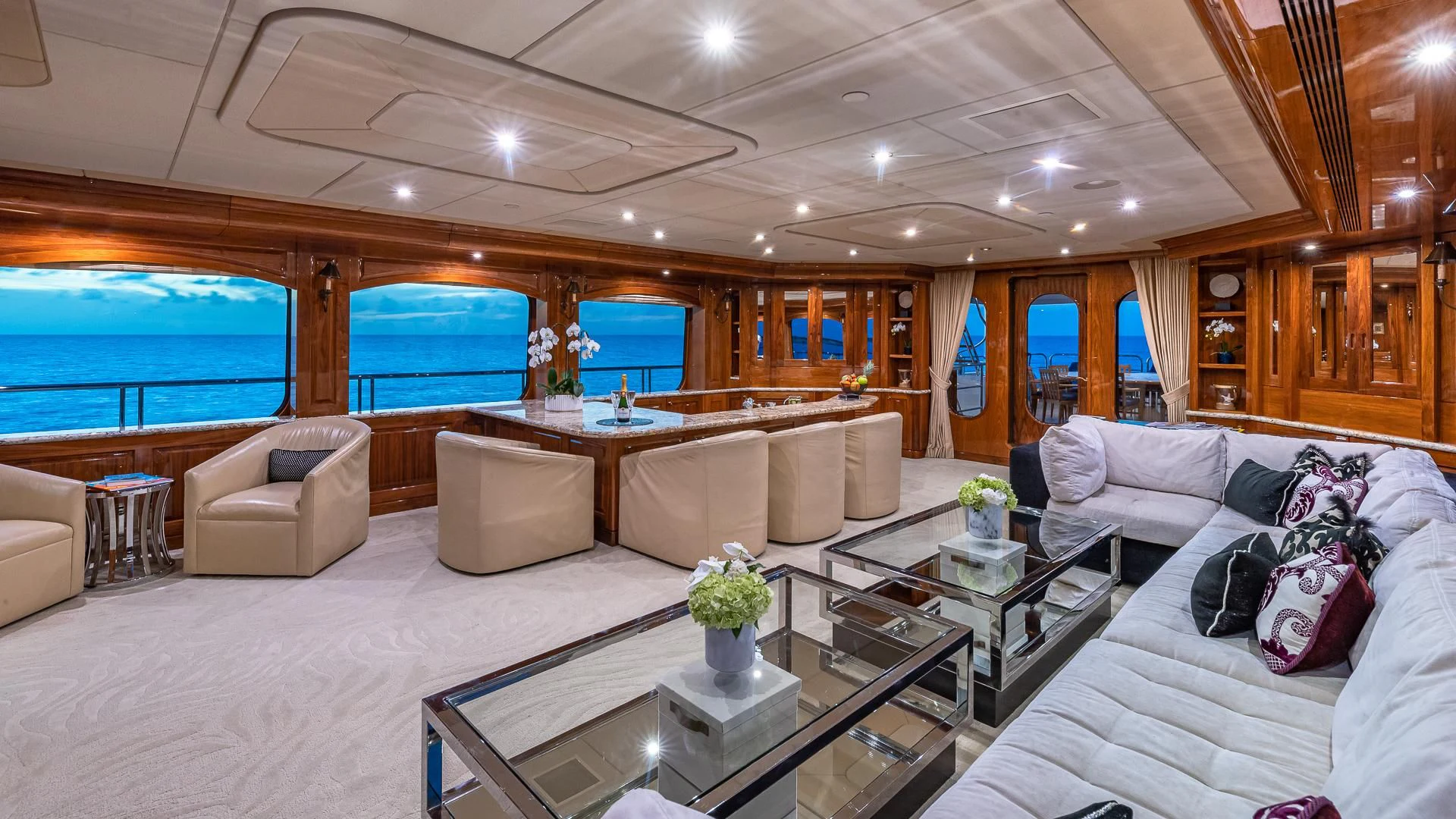a living room with a large window aboard AMORE Yacht for Charter