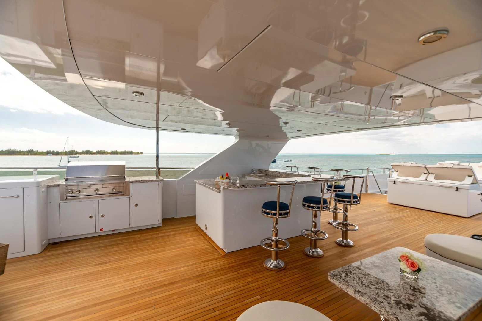 a room with a table and chairs aboard AMORE Yacht for Charter