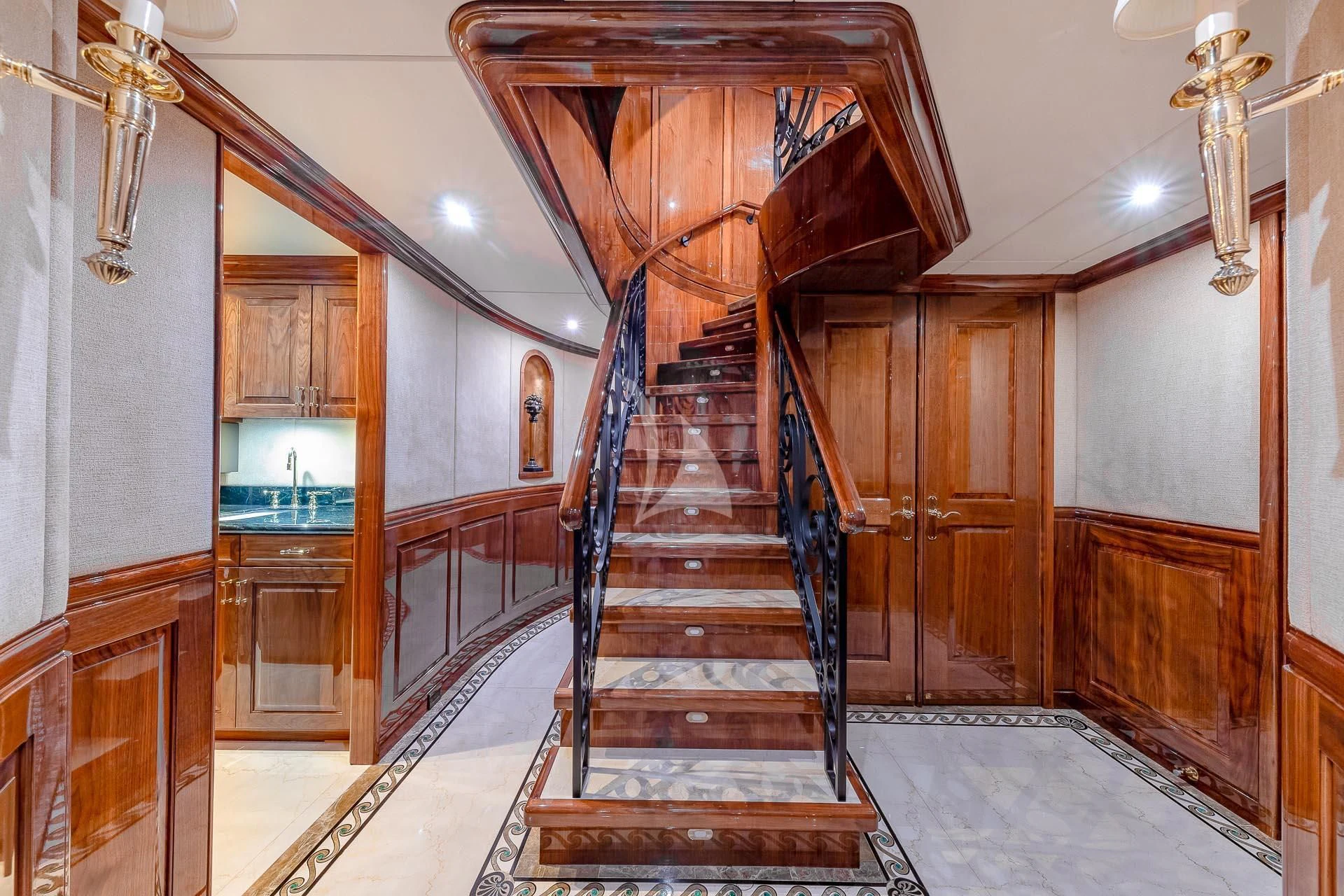 a wooden staircase in a building aboard AMORE Yacht for Charter