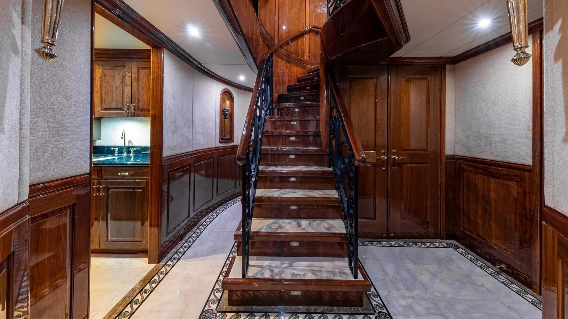 a wooden staircase in a building aboard AMORE Yacht for Charter