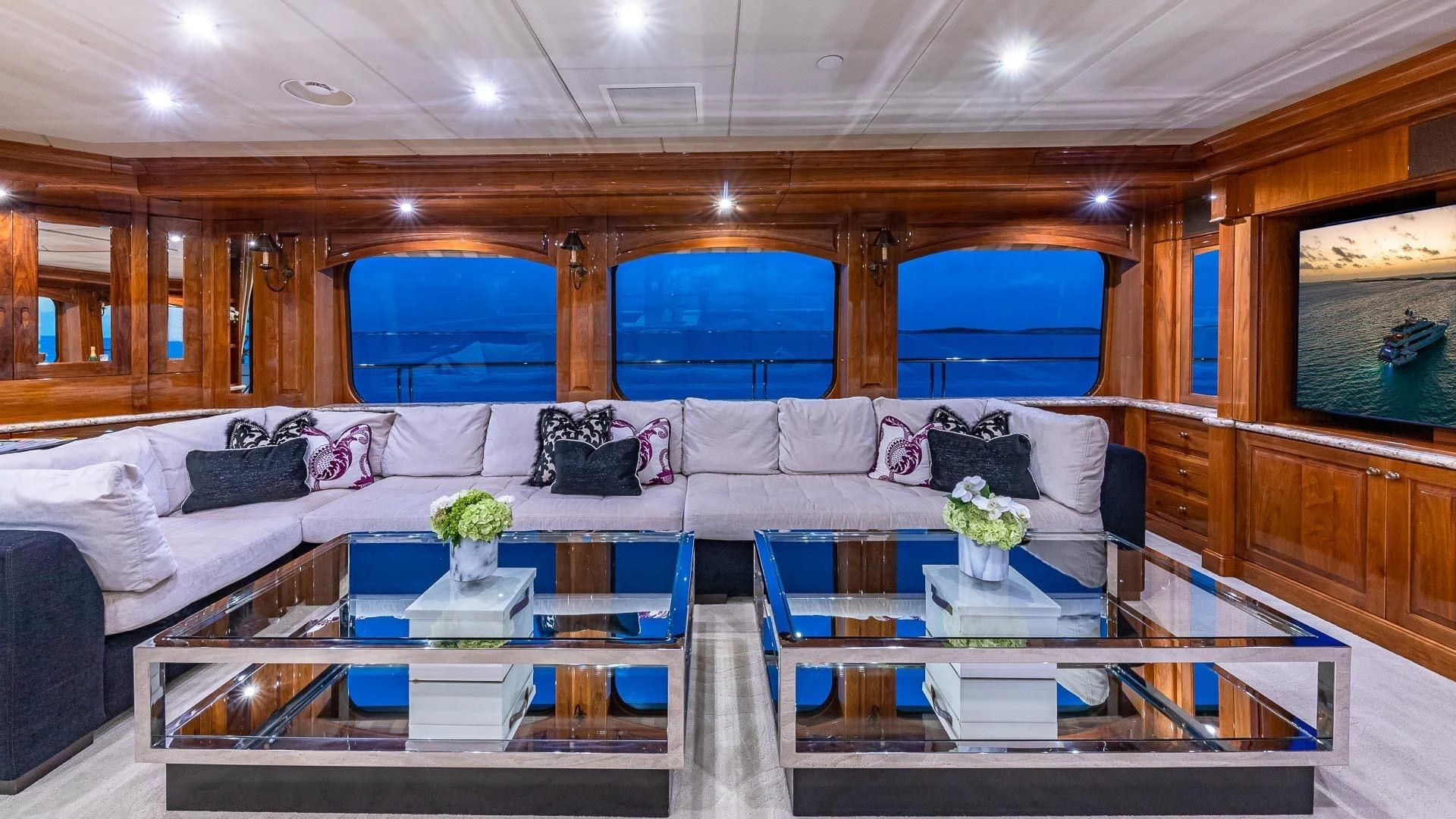 a living room with a large window aboard AMORE Yacht for Charter