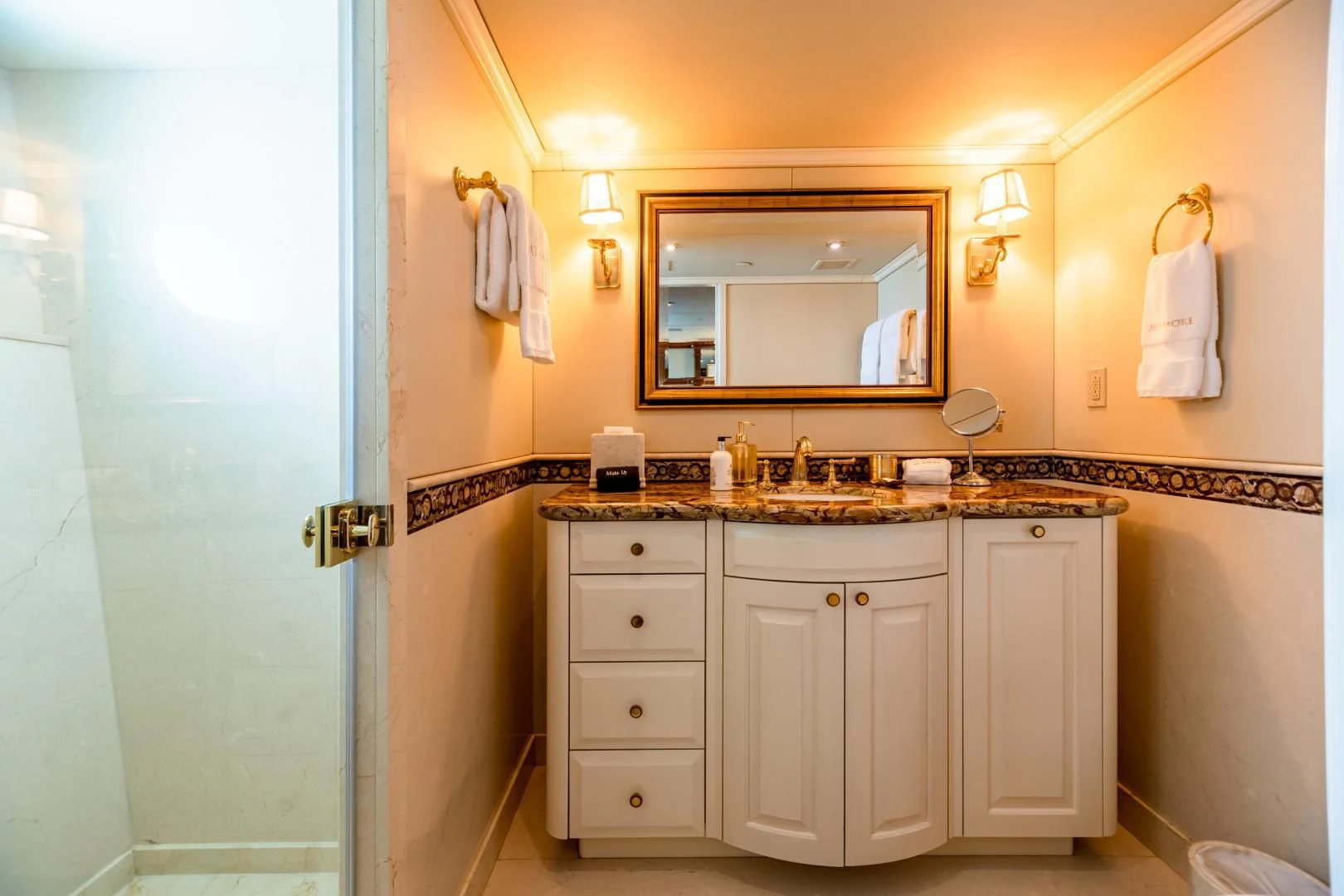a bathroom with a mirror and a sink aboard AMORE Yacht for Charter