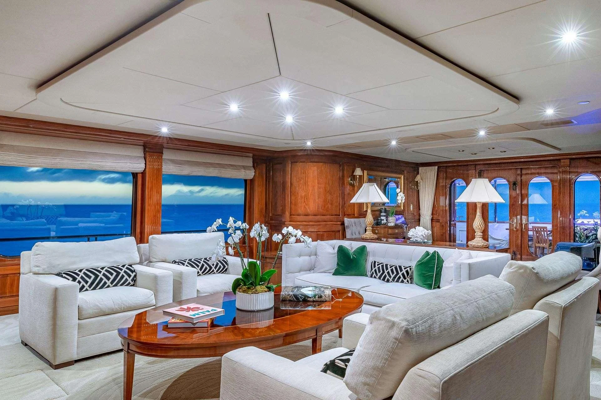 a living room with a large window aboard AMORE Yacht for Charter