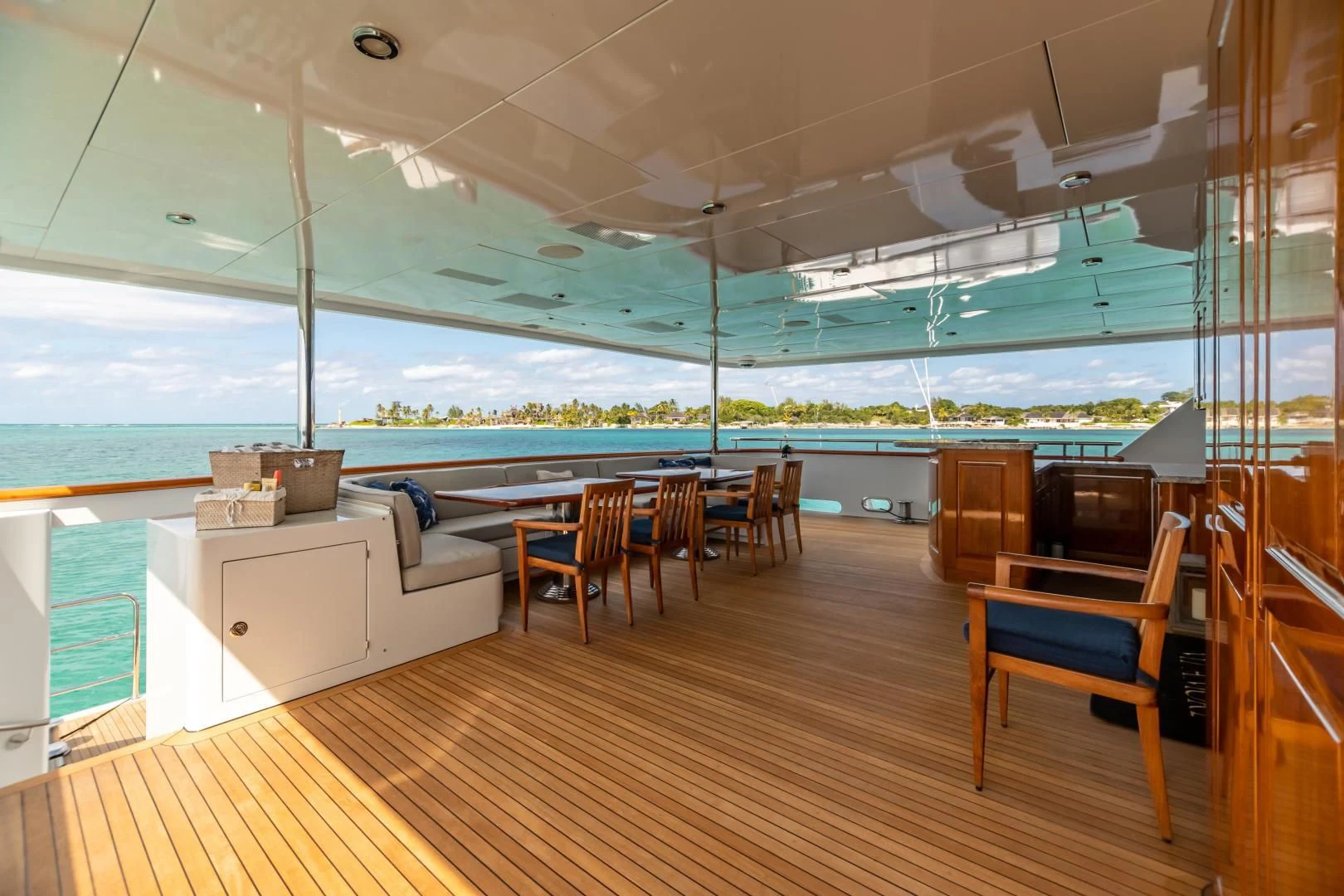 a room with a couch and a table and chairs aboard AMORE Yacht for Charter