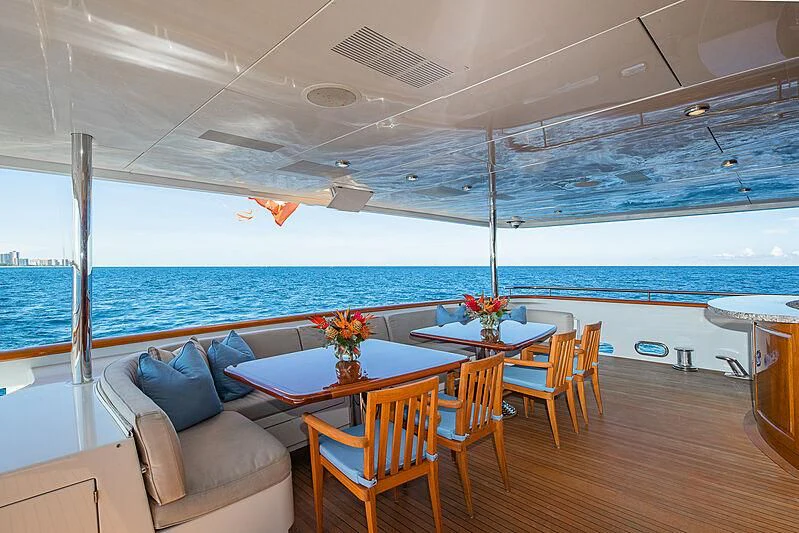 a room with a table and chairs aboard AMORE Yacht for Charter