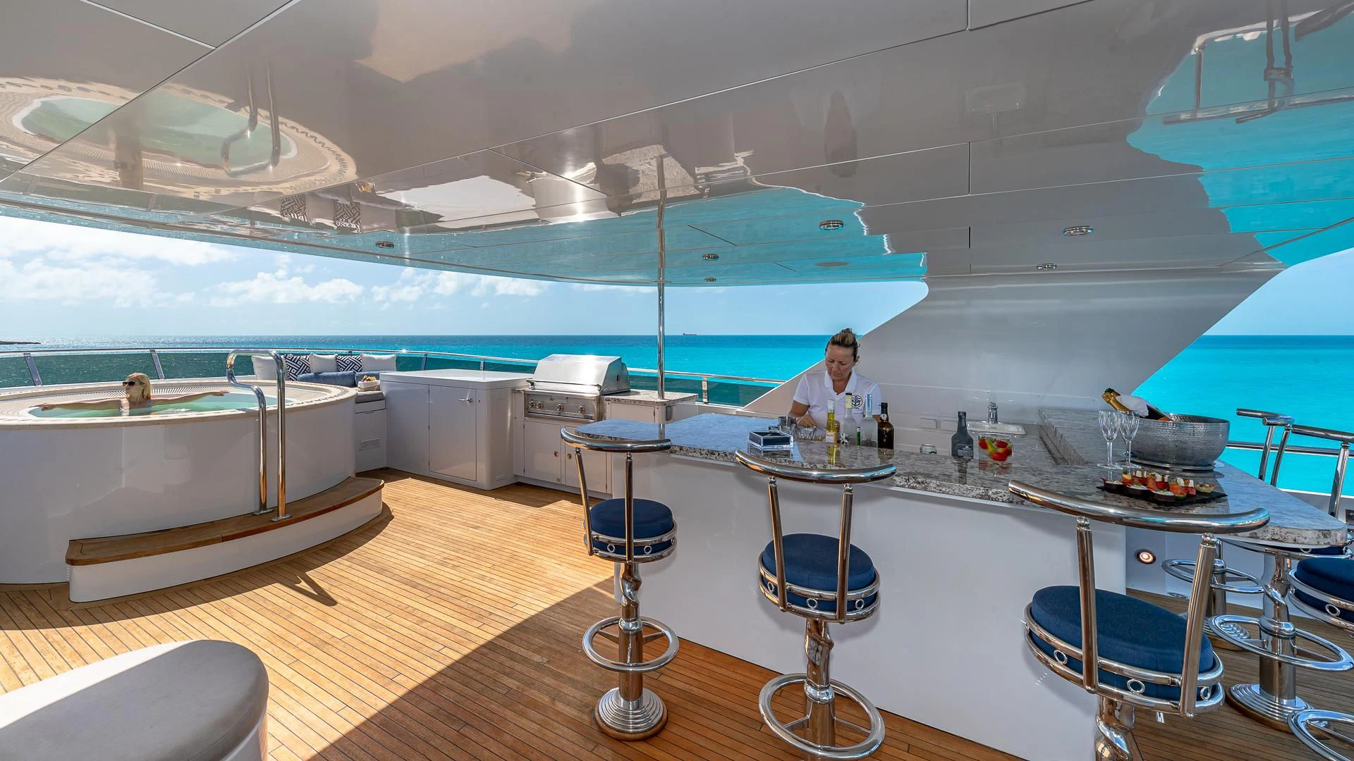 a person sitting at a table aboard AMORE Yacht for Charter