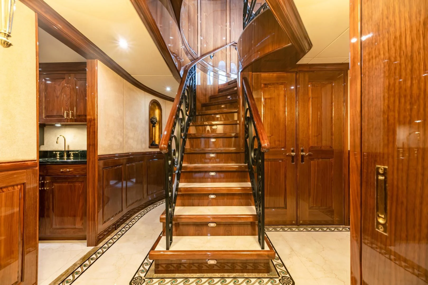 a wooden staircase in a house aboard AMORE Yacht for Charter