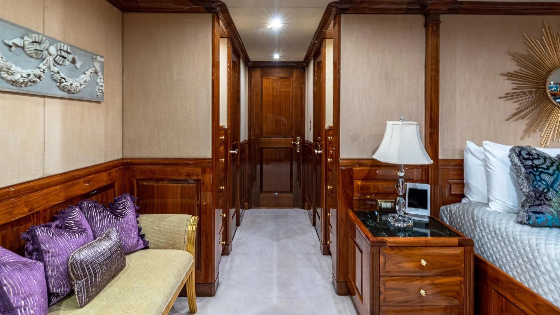 a bedroom with a bed and a desk aboard AMORE Yacht for Charter