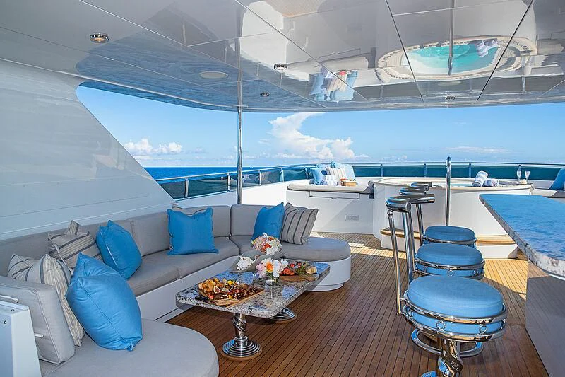 a room with a couch and a table and chairs aboard AMORE Yacht for Charter
