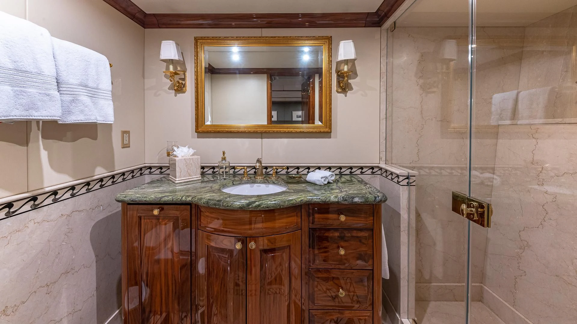a bathroom with a marble counter top aboard AMORE Yacht for Charter