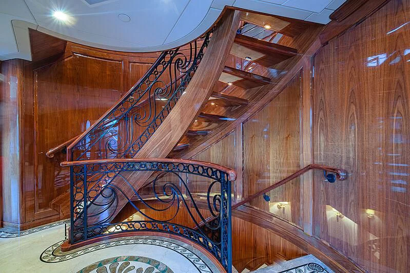 a wooden staircase in a house aboard AMORE Yacht for Charter
