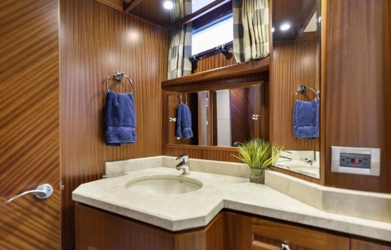 a bathroom with a mirror and a sink aboard CALYPSO Yacht for Sale
