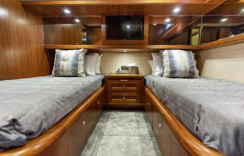 a couple of beds in a room aboard CALYPSO Yacht for Sale