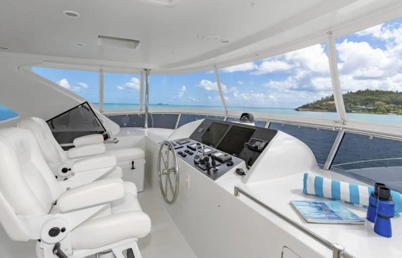 inside of a white car aboard CALYPSO Yacht for Sale