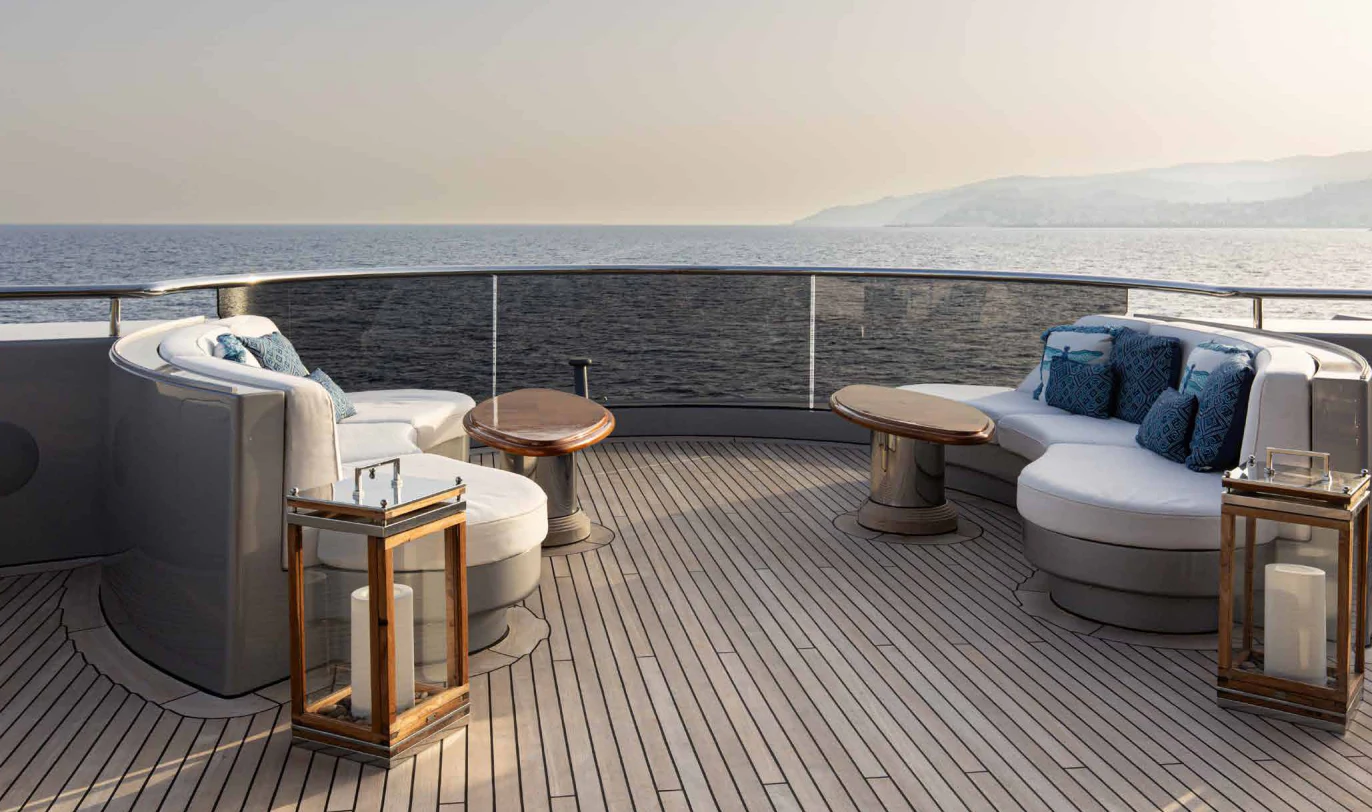 a large balcony overlooking a body of water aboard VIBRANCE Yacht for Sale