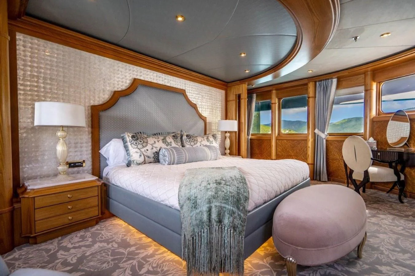 a large bedroom with a large bed aboard VIBRANCE Yacht for Sale