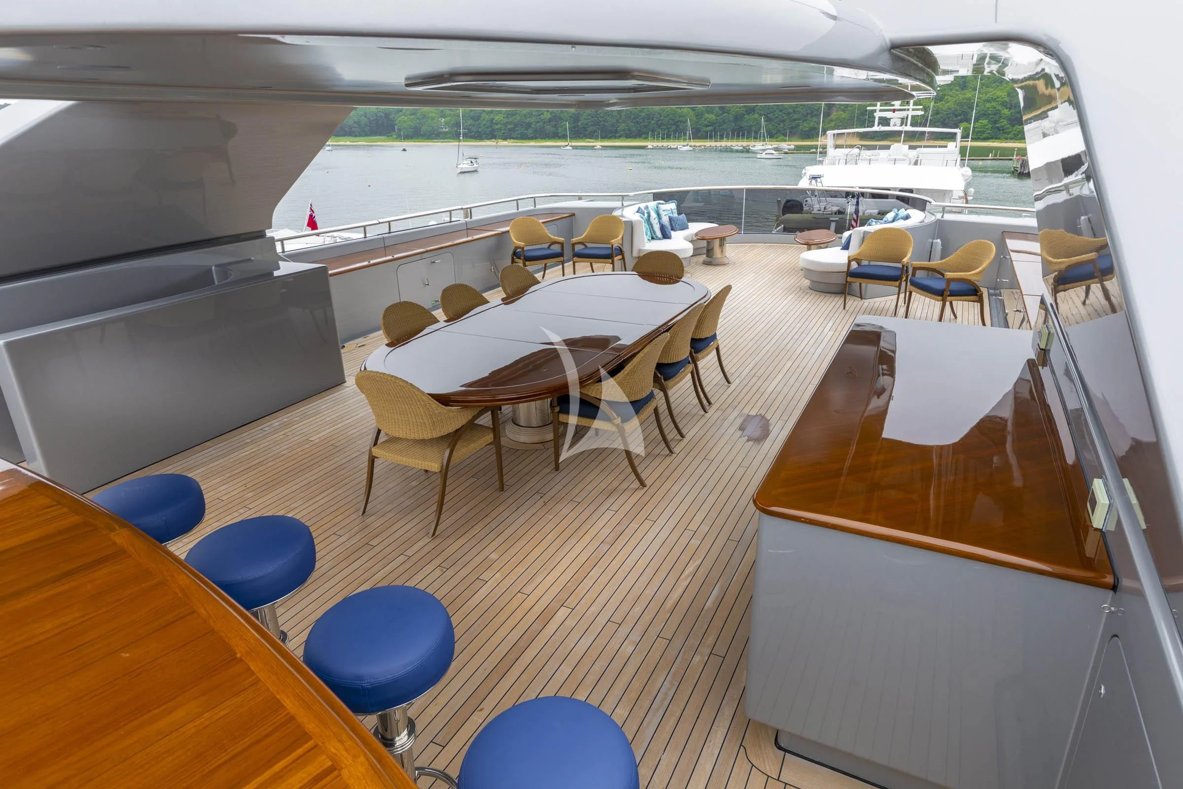 a room with tables and chairs aboard VIBRANCE Yacht for Sale