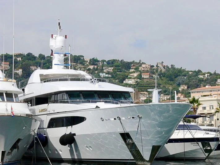 a group of boats are parked in a harbor aboard VIBRANCE Yacht for Sale