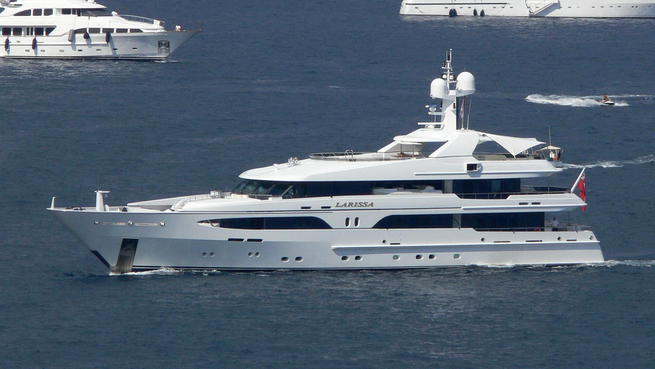 a large white yacht in the water aboard VIBRANCE Yacht for Sale