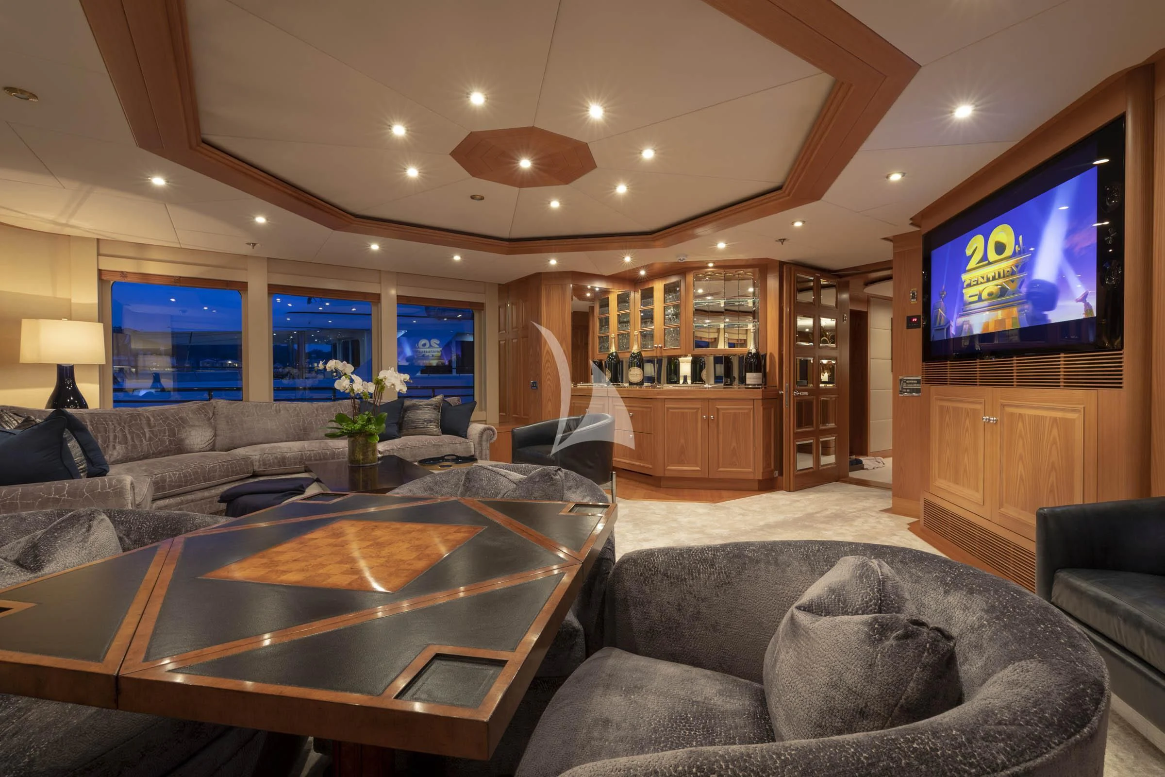 a living room with a large tv aboard VIBRANCE Yacht for Sale