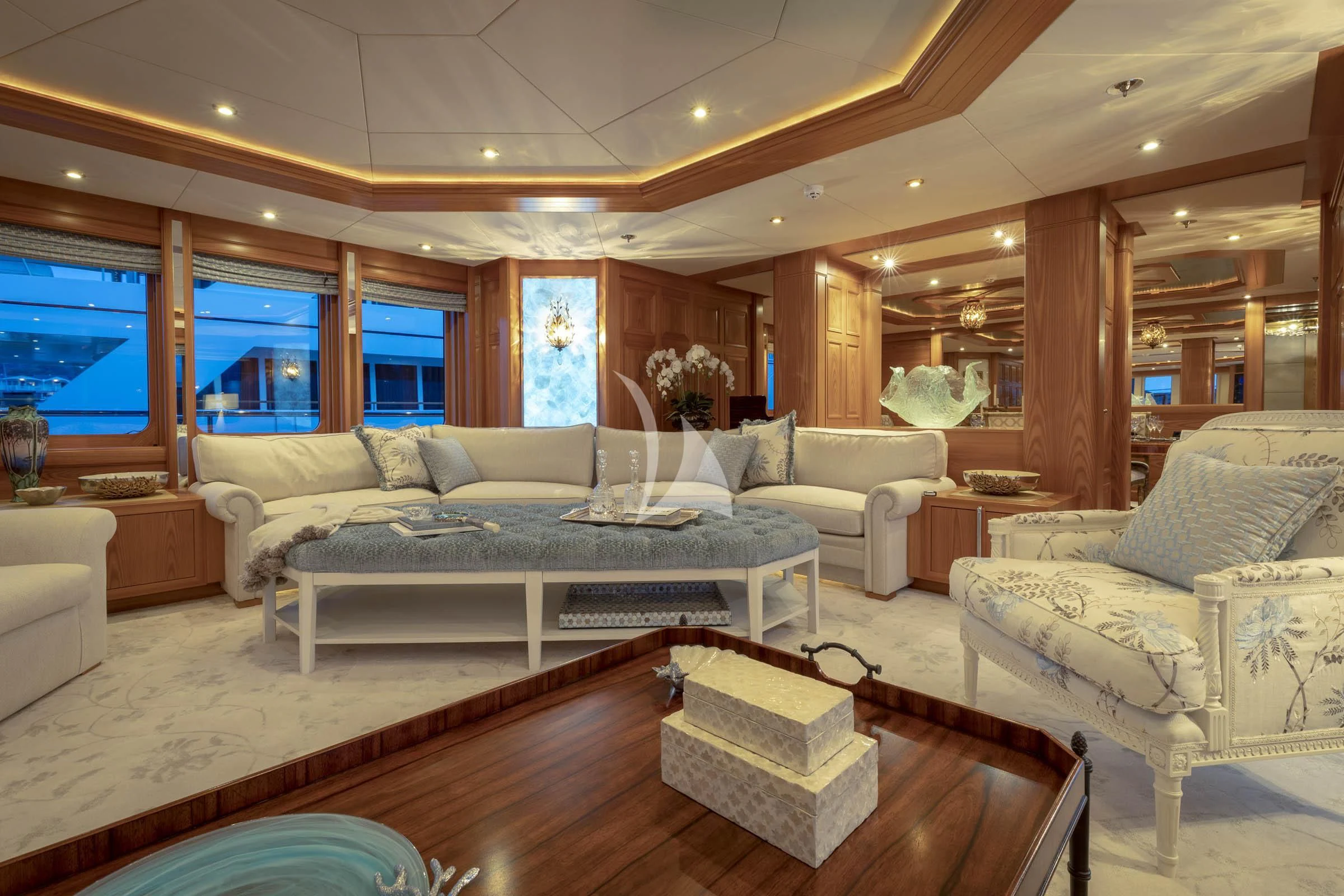 a living room with a large couch aboard VIBRANCE Yacht for Sale