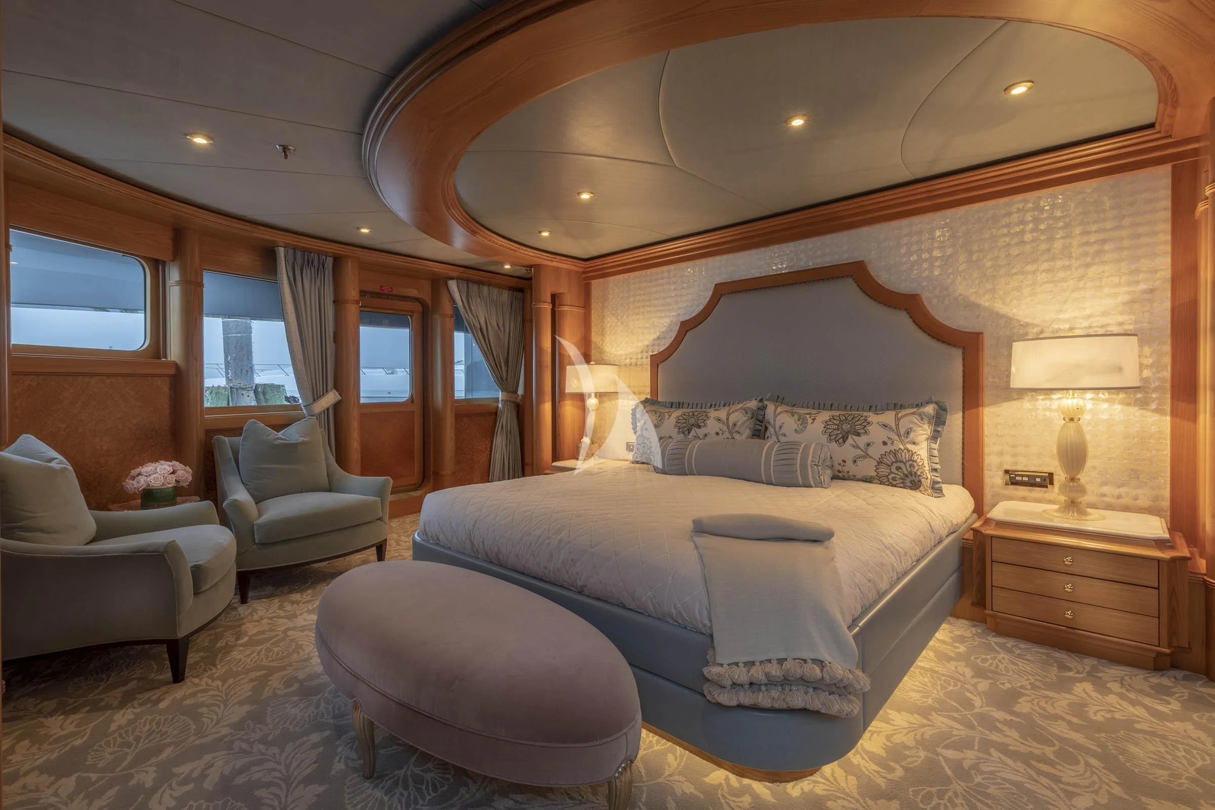 a large bedroom with a large bed aboard VIBRANCE Yacht for Sale